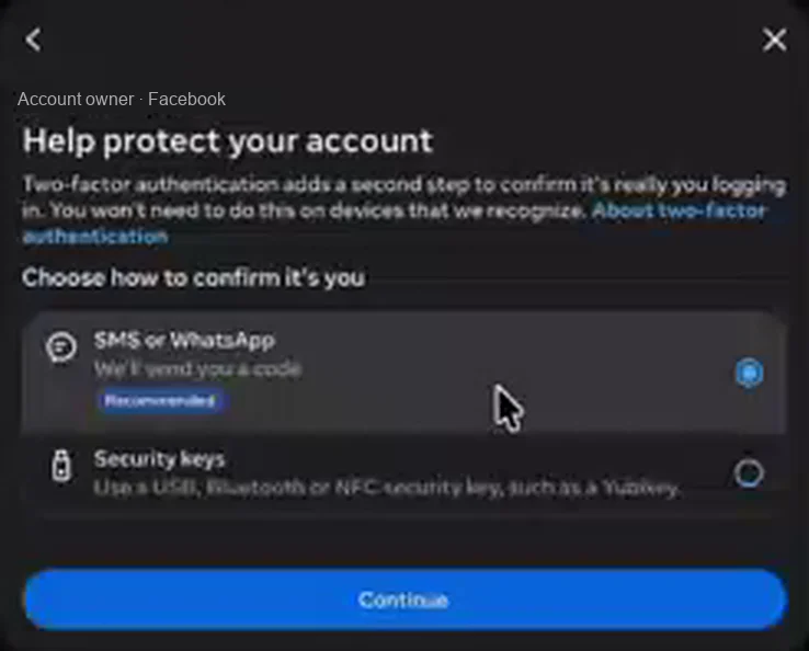 A dark Meta dialog titled Help protect your account, under the heading Choose how to confirm it's you. Two options: SMS or WhatsApp, marked Recommended and selected, and Security keys, described as a USB, Bluetooth or NFC key. A blue Continue button sits at the bottom. The account name is replaced with a placeholder.
