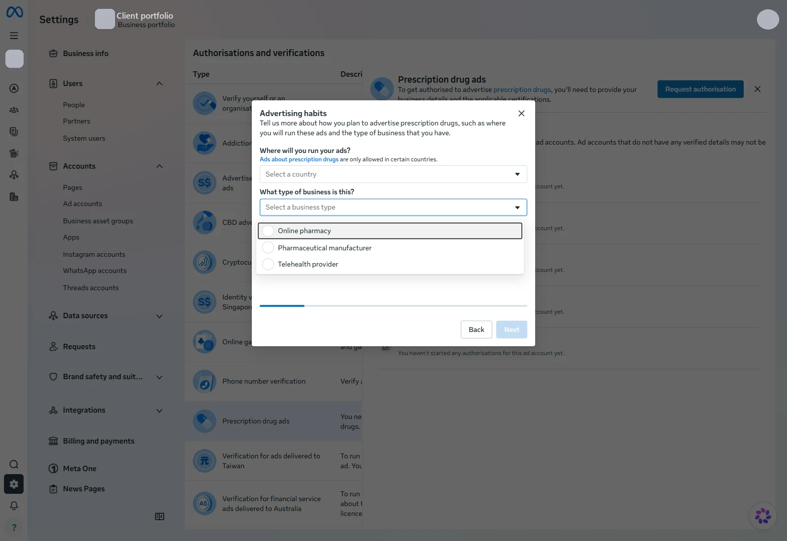 The Advertising habits step of Meta's prescription drug authorisation form. A dropdown labelled What type of business is this is open, showing three radio options: Online pharmacy, Pharmaceutical manufacturer, and Telehealth provider. A progress bar sits below at roughly one third. Portfolio name, account names and the profile photo are redacted.